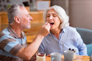 Older couple over 50 eating a keto-dessert