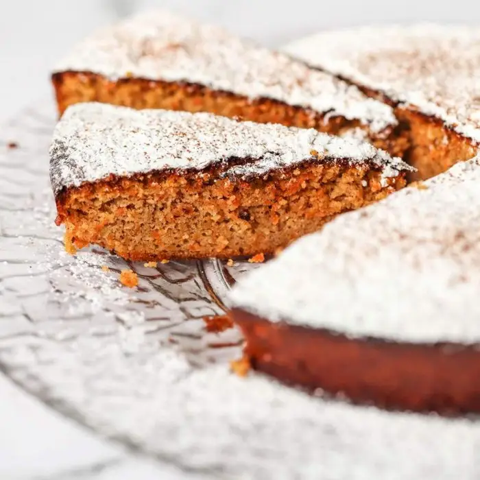 Flourless carrot cake dusted with powdered sugar